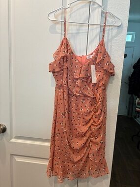 All in Favor Coral Polka Dot Ruffle Mini Dress